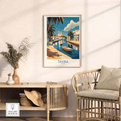 Tavira Riverside Poster, Portugal Travel Print displayed in a stylish living room setting with palm trees and a scenic view.