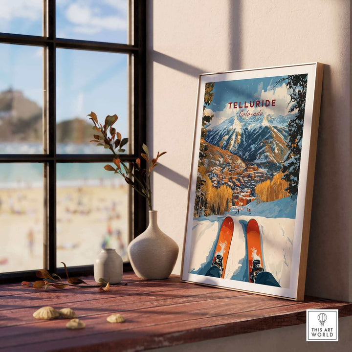 Telluride Ski Poster displayed on a windowsill with a scenic winter landscape, perfect for ski enthusiasts and art lovers.