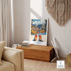 Vintage Telluride Wall Art Ski Poster showcasing a mountain landscape, displayed in a cozy living room setting.