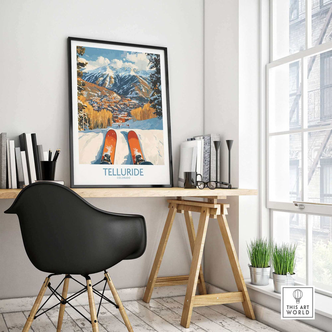 Telluride wall art ski poster on modern desk, featuring snow-capped mountains and skis, perfect for ski enthusiasts and home decor.