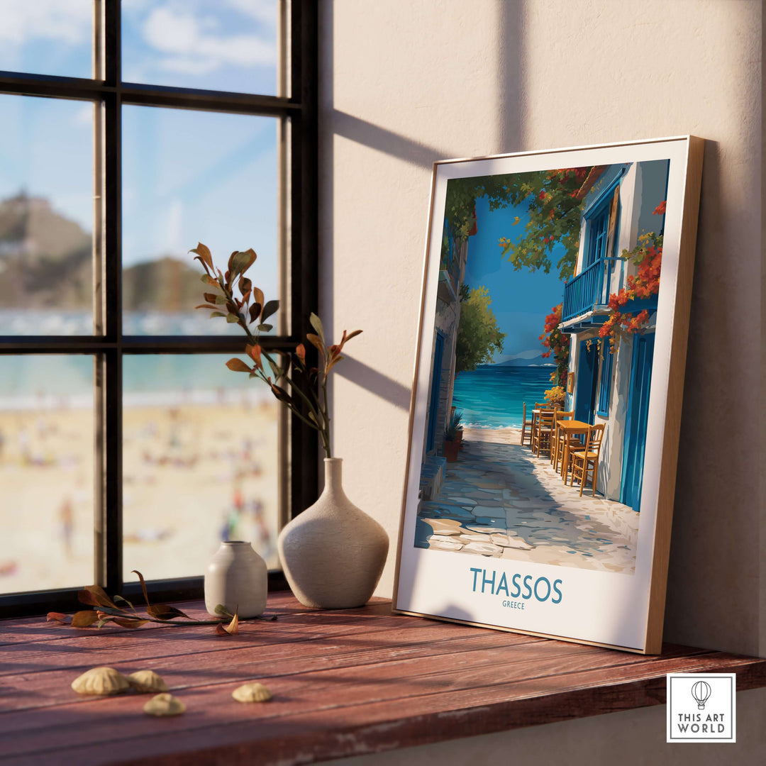 Thassos Greece Print | Island Beach Poster displayed on a wooden table near a window with a beach view.