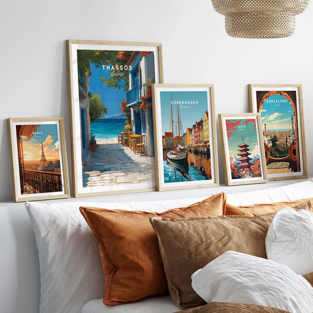 Thassos Poster | Greek Island Wall Decor displayed among other travel posters on a cozy sofa.