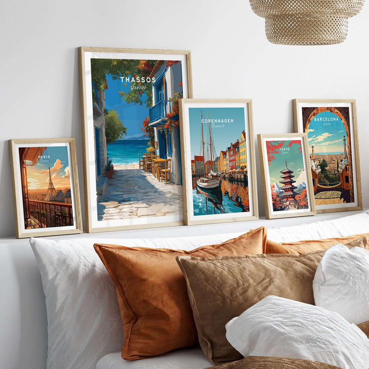 Thassos Poster | Greek Island Wall Decor displayed among other travel posters on a cozy sofa.