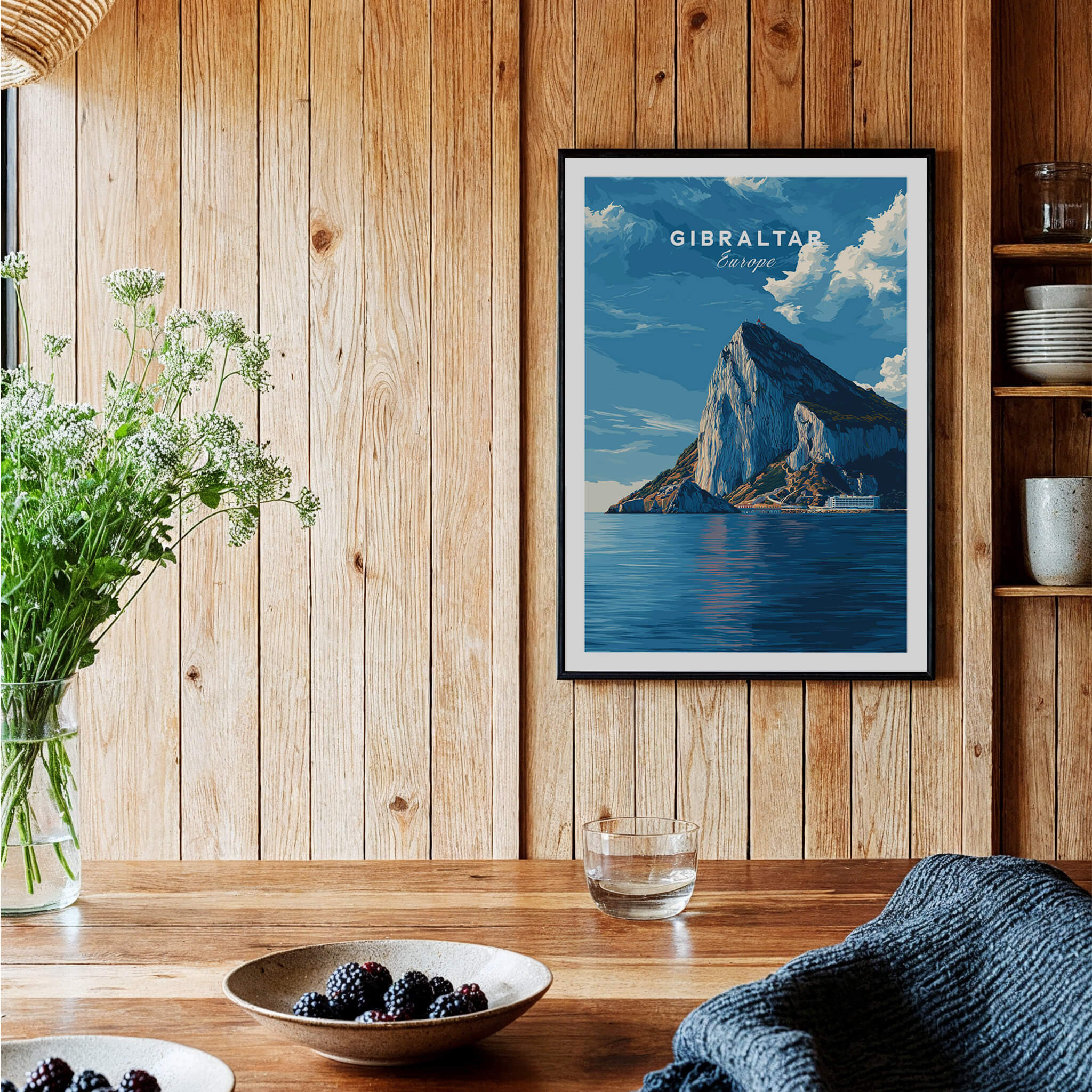 The Rock of Gibraltar Canvas Art Print displayed on a wooden wall, highlighting its vibrant colors and iconic shape.