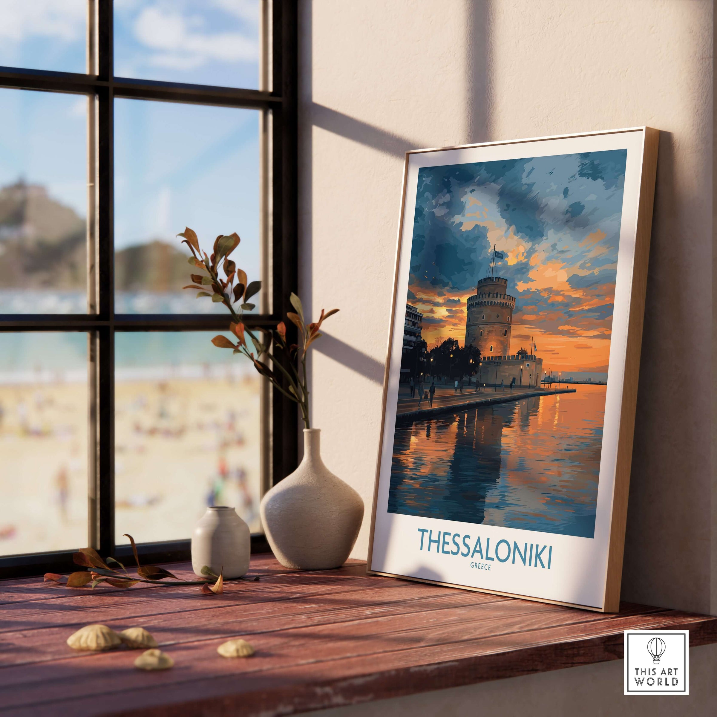 Thessaloniki Greece Sunset Print | Golden Hour Waterfront Poster displayed on a windowsill with scenic beach view.