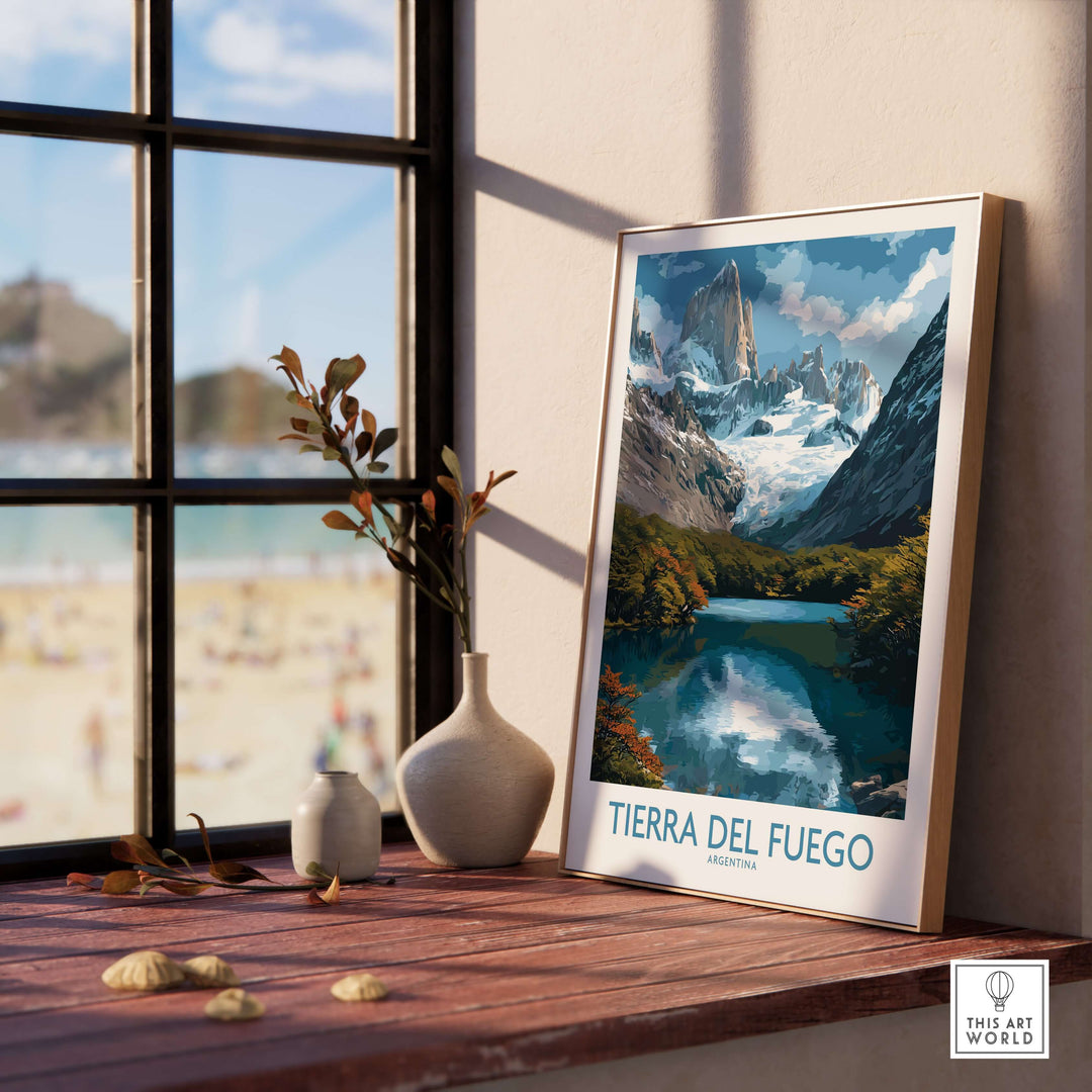 Tierra del Fuego Argentina Fitz Roy Glacier Art Print | Mountain Lake Poster displayed on a wooden table by a window.