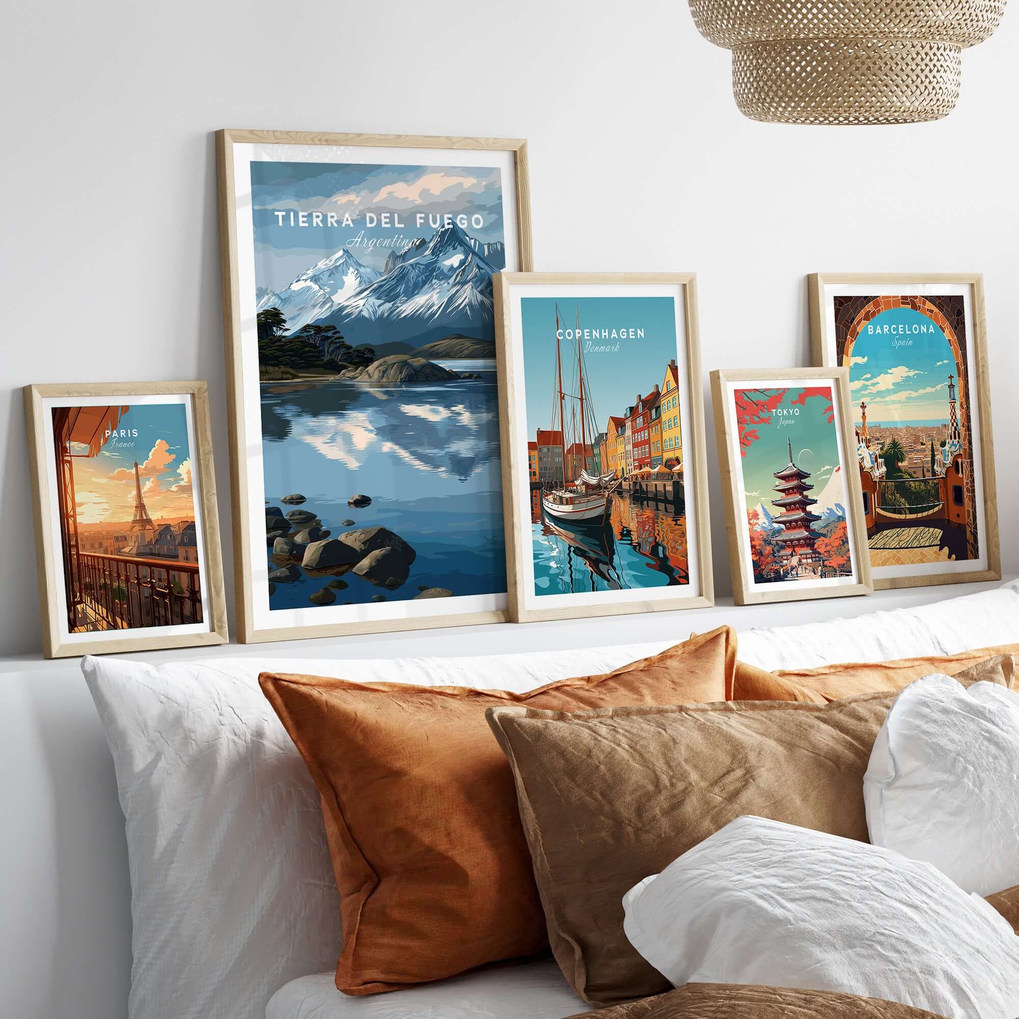 Tierra del Fuego Patagonian Alps Landscape Print | South America Poster displayed with other travel-themed prints on a cozy bed.