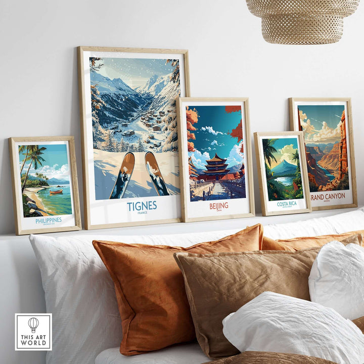 Framed travel posters including Tignes, Beijing, Costa Rica, and the Grand Canyon displayed on a stylish wall.