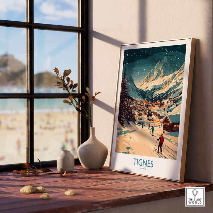 Stylish Tignes ski poster wall art on a sunlit windowsill, featuring a scenic snowy mountain village landscape.