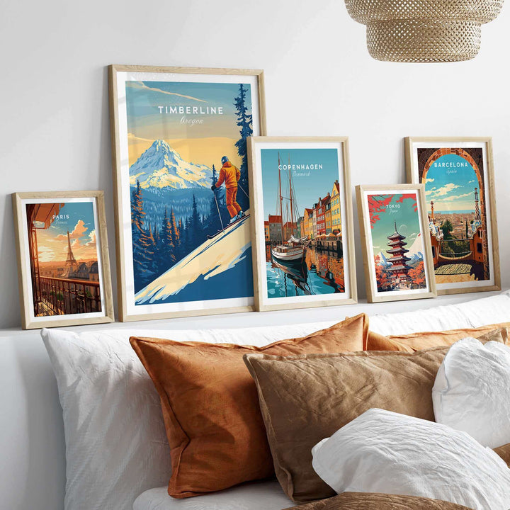 Collection of framed travel posters featuring Timberline Oregon ski scene and various cityscapes displayed on a stylish shelf.