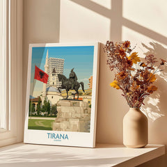 Tirana Albania Skanderbeg Square Art Print | National Monument Poster displayed beside flowers in a vase.