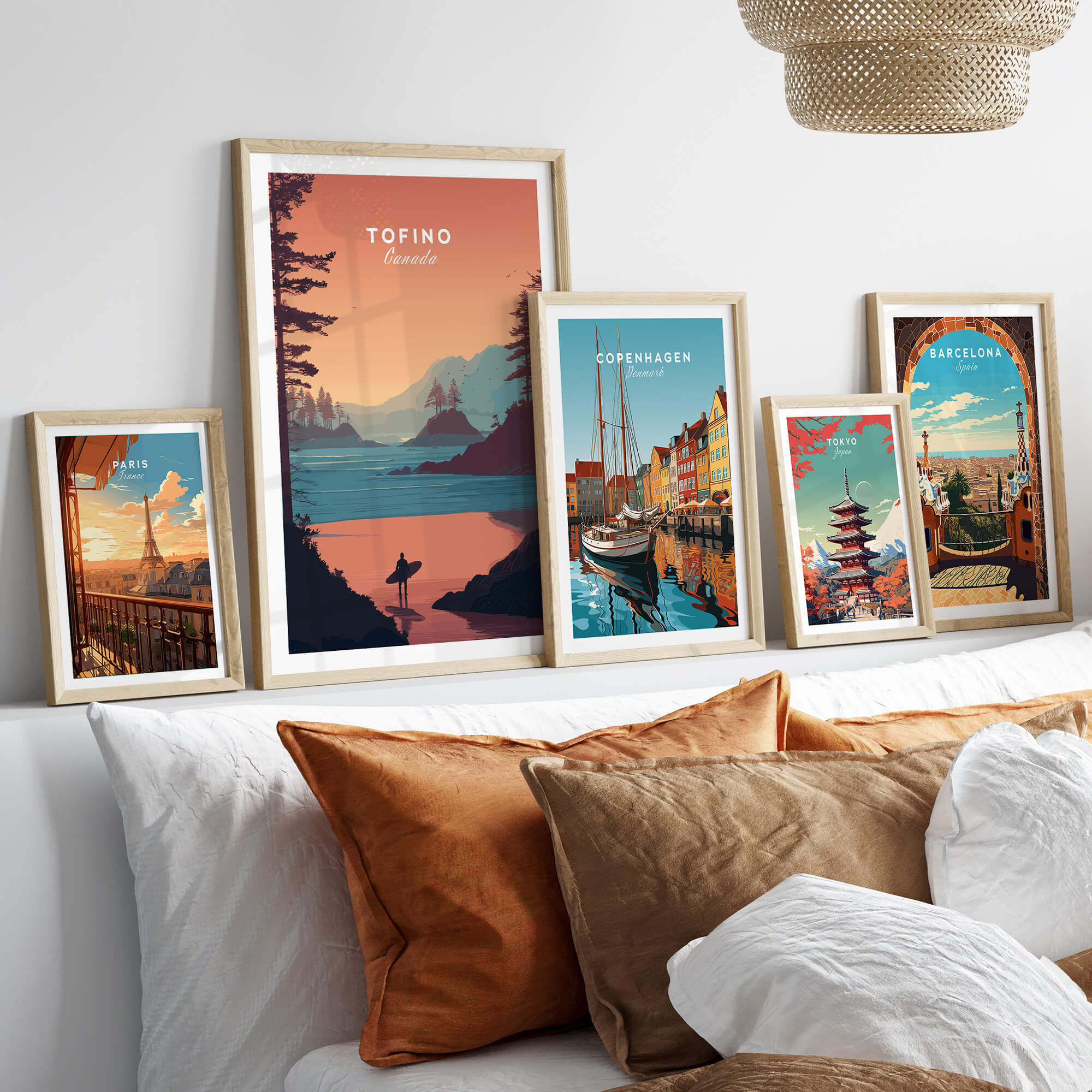 Tofino Canada Travel Poster | Sunset Beach Landscape Wall Art Print displayed among other travel posters in a cozy interior setting.