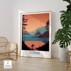 Tofino Canada Canvas Print | Coastal Pine Tree & Ocean View Poster displayed in a modern interior with a chair and plant.