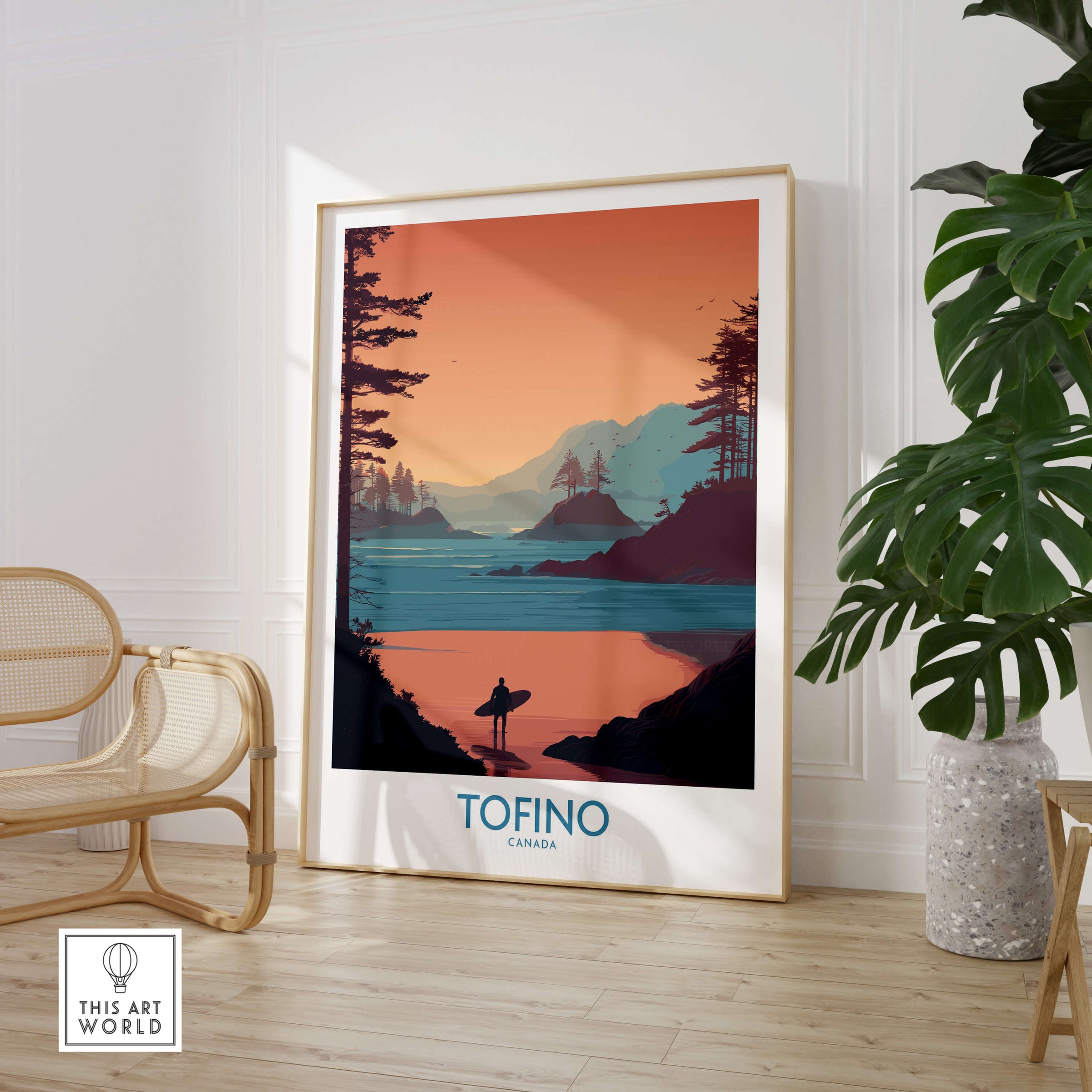 Tofino Canada Canvas Print | Coastal Pine Tree & Ocean View Poster displayed in a modern interior with a chair and plant.