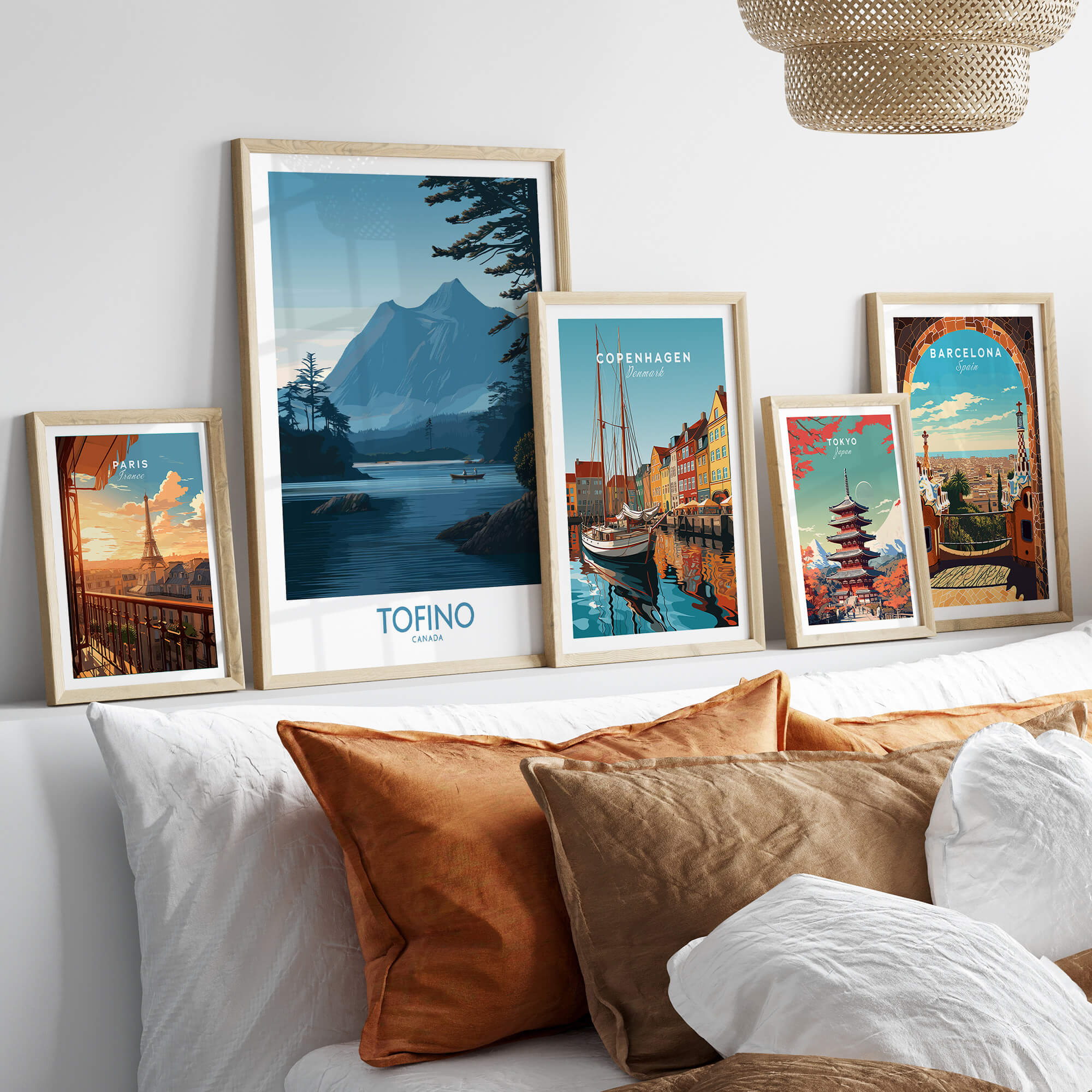 Tofino Canada Poster | Serene Canoe Landscape Scene Canvas Print displayed among various travel posters on a stylish couch.