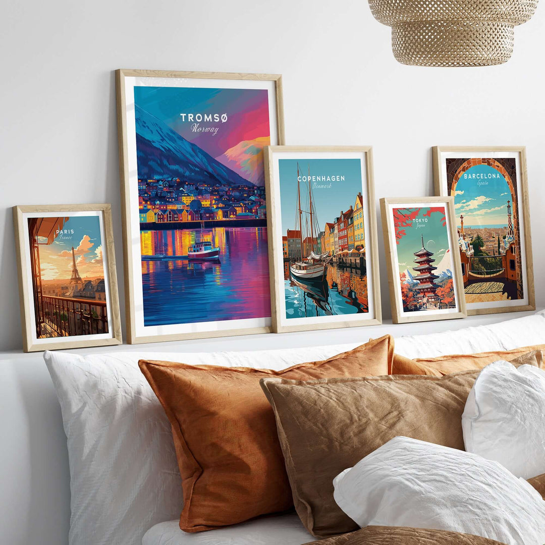 Tromsø Arctic City Lights and Aurora Sky Print | Nordic Travel Art showcased among other city prints on a stylish couch.