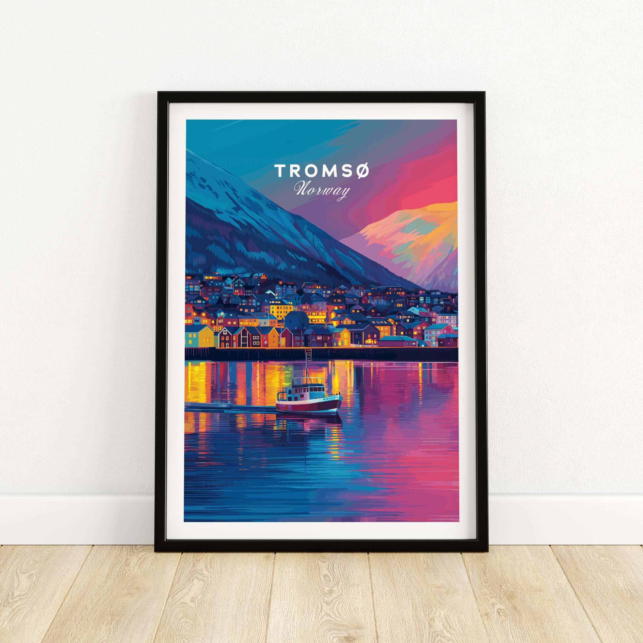Tromsø Arctic City Lights and Aurora Sky Print | Nordic Travel Art displayed in a black frame, showcasing vibrant city lights.