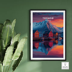 Tromsø Poster Arctic Fjord Town Print | Norwegian Wall Art displayed on a green wall with a plant.