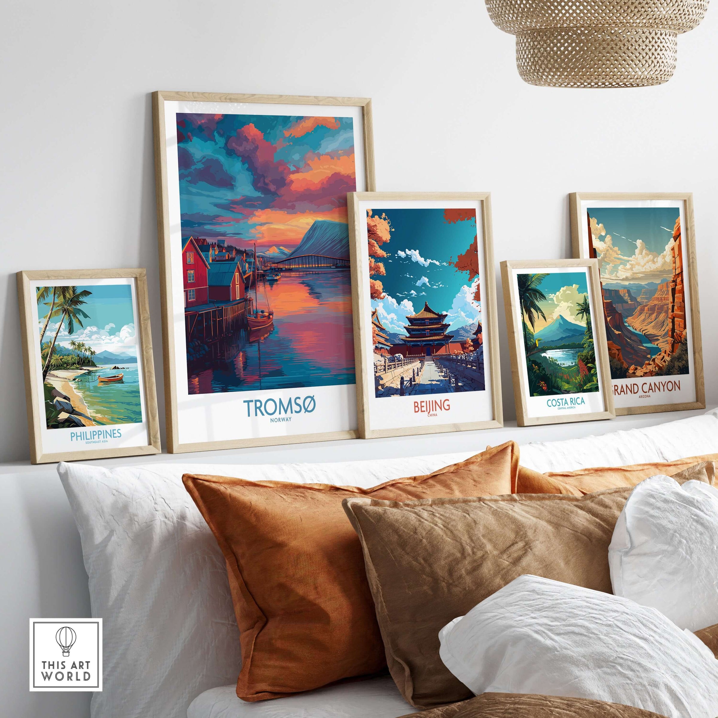 Tromsø Norway Arctic Art Print | Northern Lights Town Poster displayed among other art prints on a cozy couch.