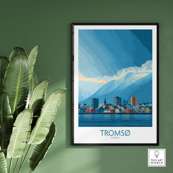 Tromsø Norway Art Print | Snowy Mountain City Poster displayed in a modern interior with plants.