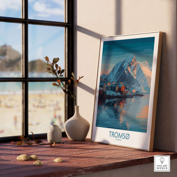 Tromsø Norway Art Print | Winter Village Poster displayed in a cozy interior setting by a window.