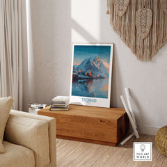 Tromsø Norway Art Print | Winter Village Poster displayed in a cozy living room setting with wooden decor.