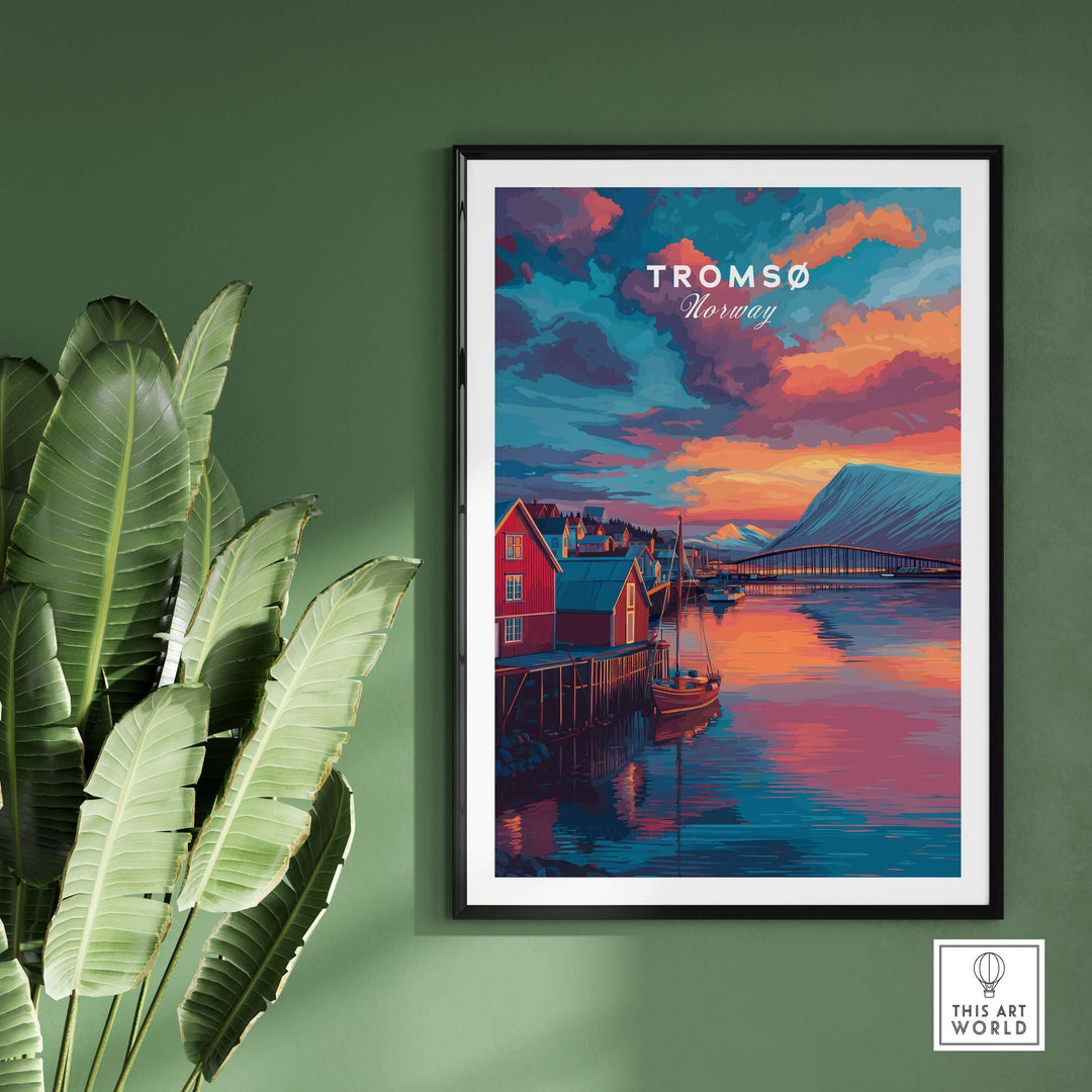 Tromsø Norway Fjord Town Sunset Print | Nordic Travel Wall Decor framed on green wall with indoor plant