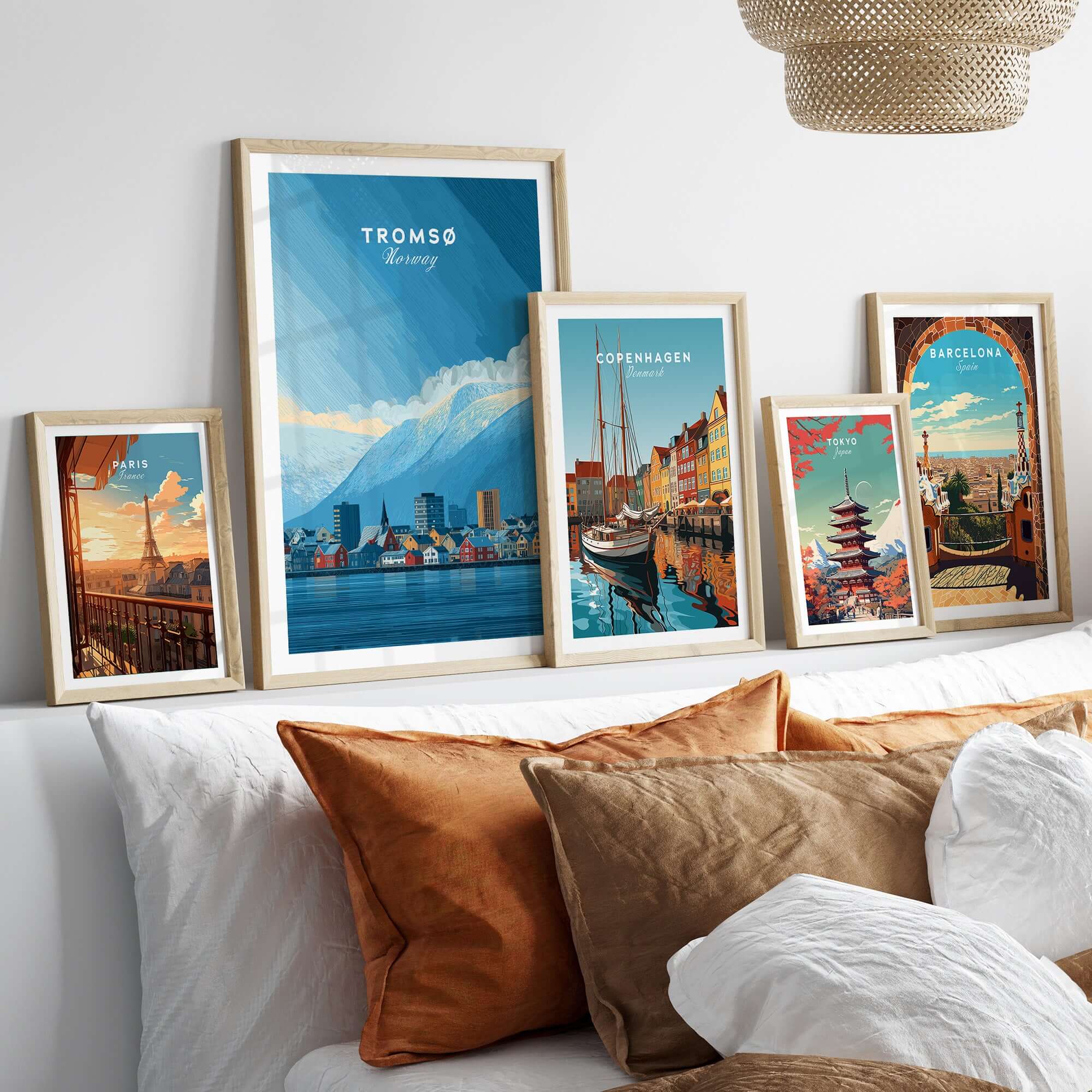 Tromsø Wall Art Print | Norwegian City Wall Decor displayed among other city prints on a stylish sofa.