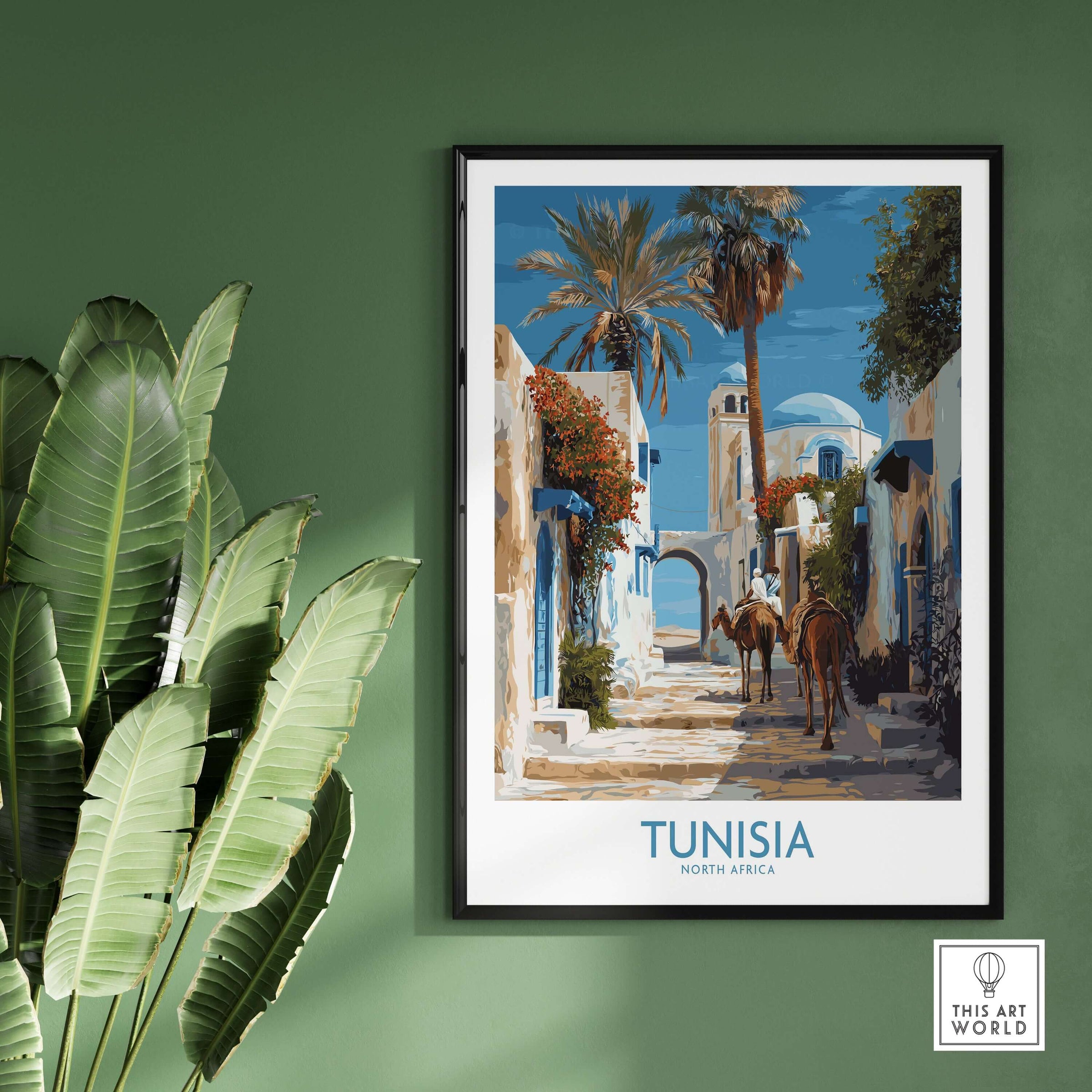 Tunisia Poster - North Africa Wall Art with Camels displayed on a green wall, showcasing desert landscapes and cultural beauty.
