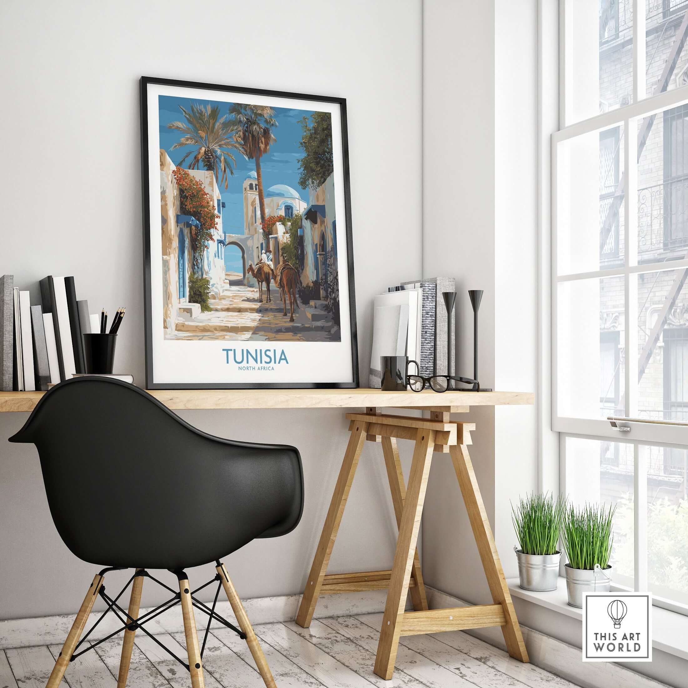 Tunisia Poster - North Africa Wall Art with Camels displayed in a modern workspace, featuring a scenic Tunisian landscape.