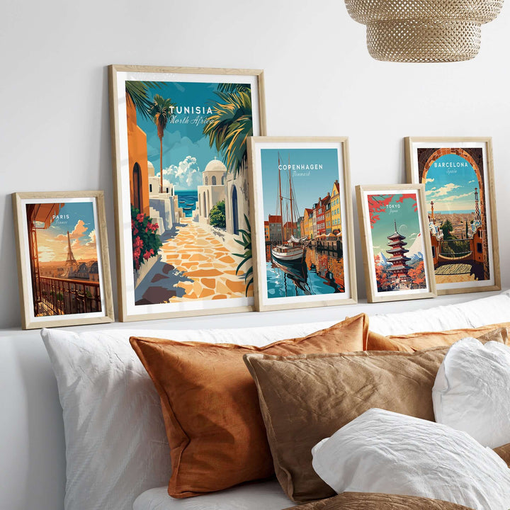 Colorful Tunisia wall art print alongside other city posters in a stylish living room decor setting.