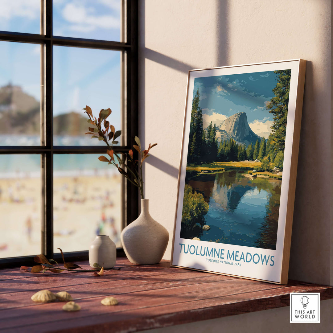 Tuolumne Meadows Yosemite Art Print displayed by a window with mountains and a lake view in the background.