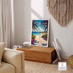 Turks and Caicos Travel Print framed on a wooden table in a cozy living room setting, evoking tropical vibes.