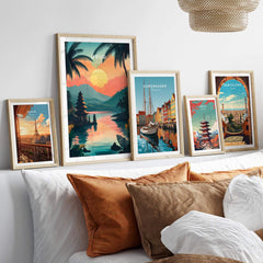 Ubud Bali Travel Print and other travel posters displayed on a stylish couch, bringing vibrancy to any decor.