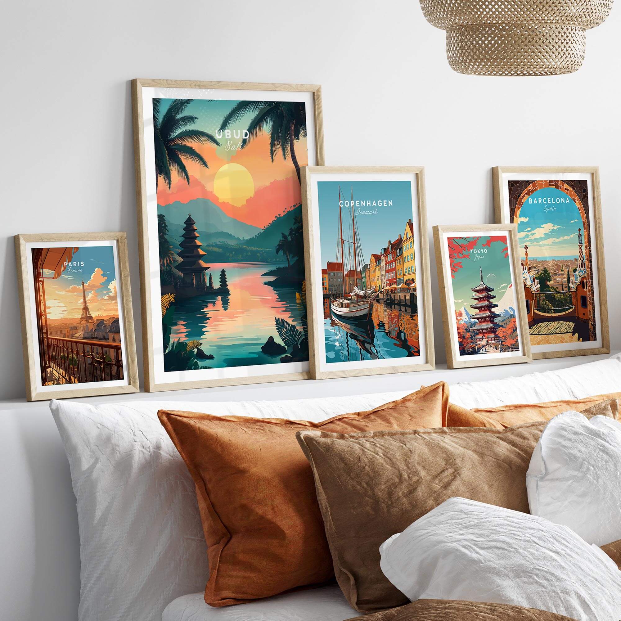 Ubud Bali Travel Print and other travel posters displayed on a stylish couch, bringing vibrancy to any decor.
