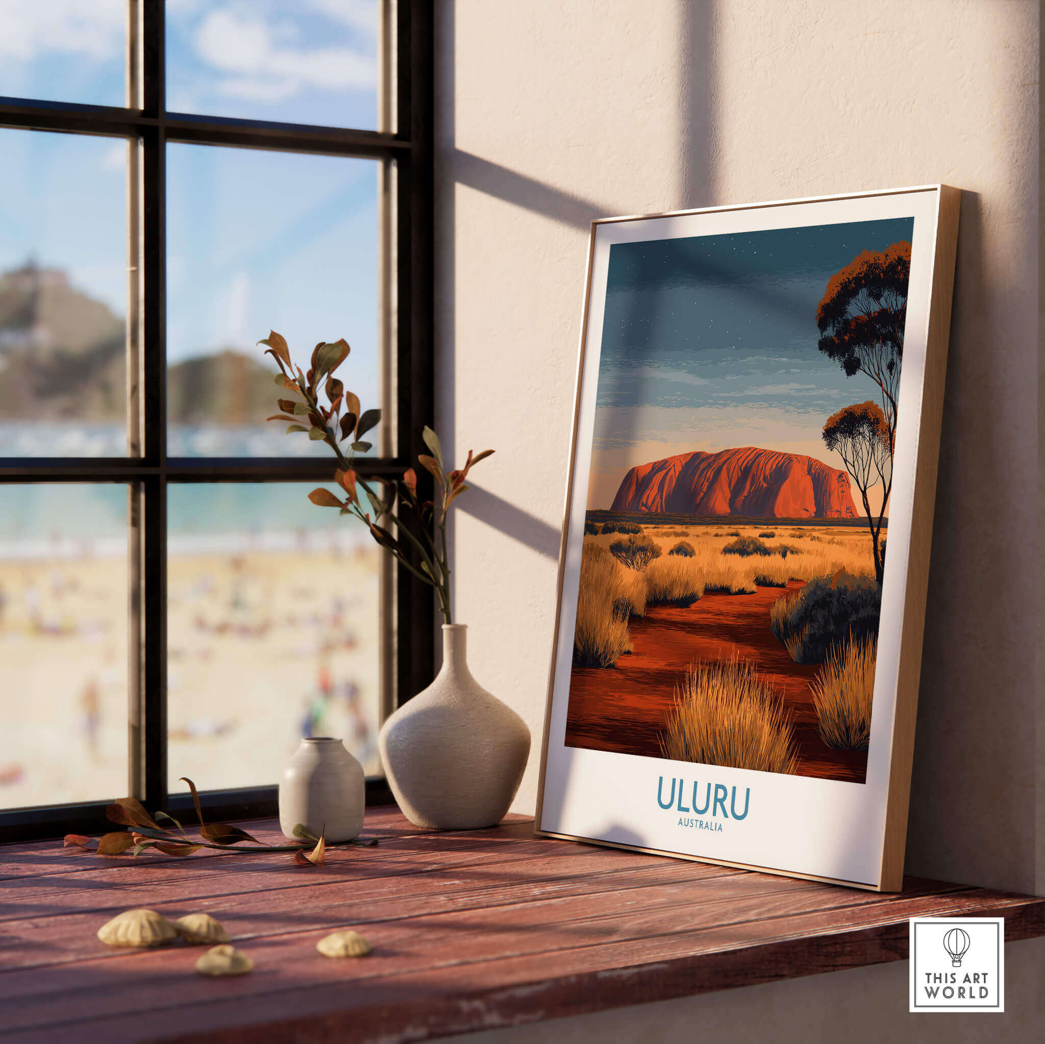 Uluru Australia Poster | Desert Sunset Canvas Print displayed on a wooden table by a sunlit window.