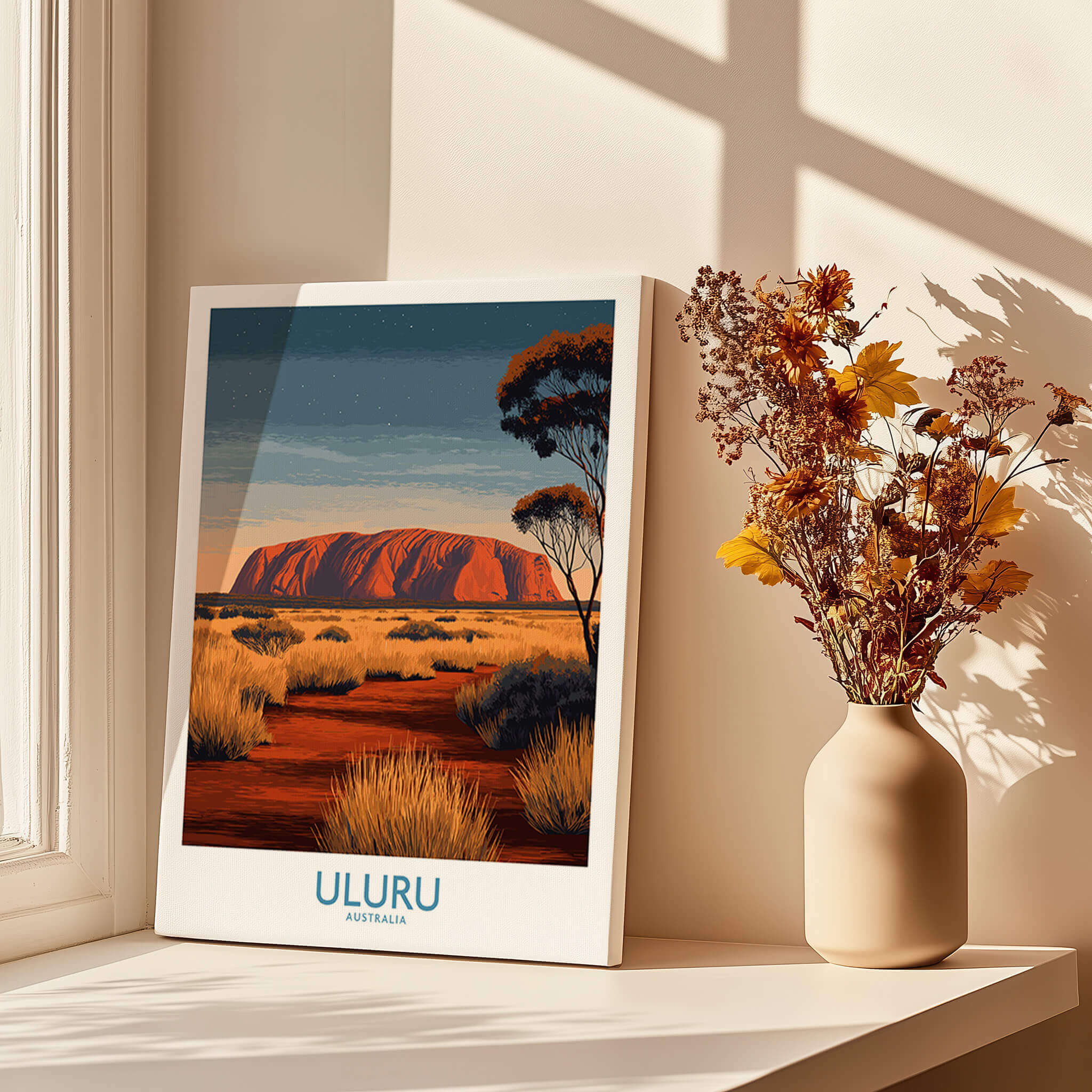 Uluru Australia Poster | Desert Sunset Canvas Print captured in a bright and modern room setting with a vase of flowers.