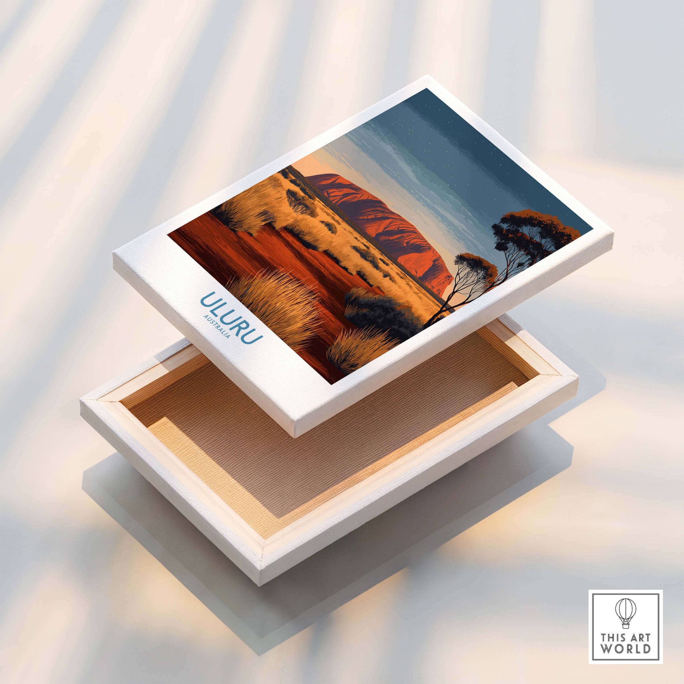 Uluru Australia Poster | Desert Sunset Canvas Print displayed on a wooden box with vibrant hues of sunset.