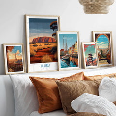 Uluru Australia Poster | Desert Sunset Canvas Print displayed among travel art in a stylish living room setting.