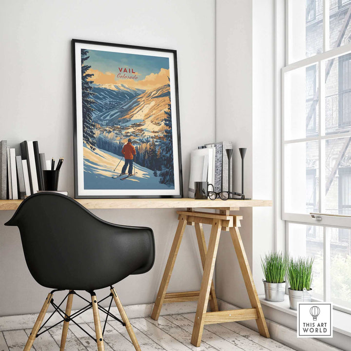 Framed Vail Print Colorado Ski Poster displayed on a desk in modern home office decor, featuring scenic mountain view.