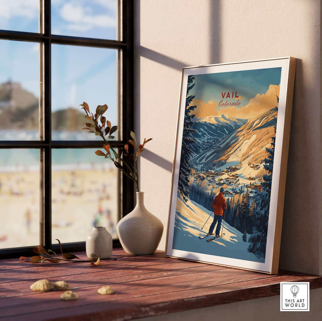 Vintage Vail Colorado ski poster on window shelf, showcasing a serene mountain view with a skier, perfect for home decor.