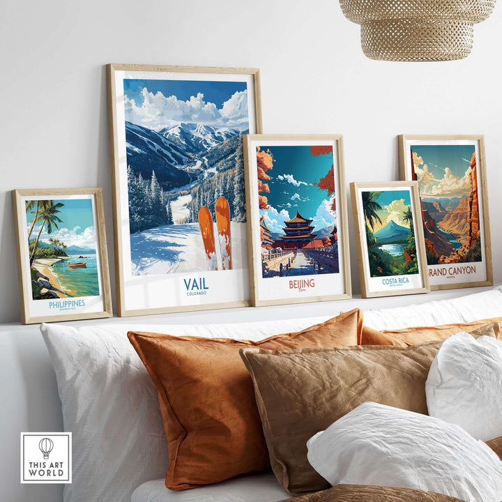 Vail Ski Print displayed among travel-themed wall art including Beijing, Costa Rica, and Grand Canyon on a cozy couch setup.