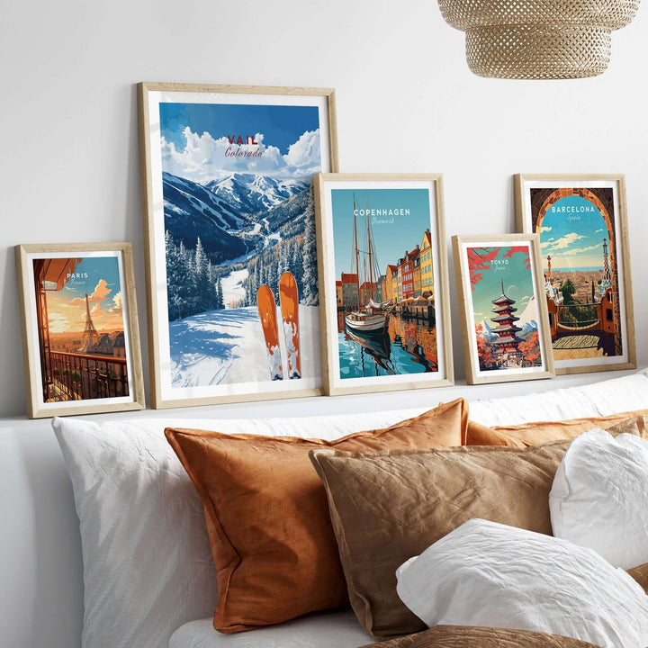 Vail travel poster framed with other city posters, showcasing stunning mountain views and cozy decor elements.