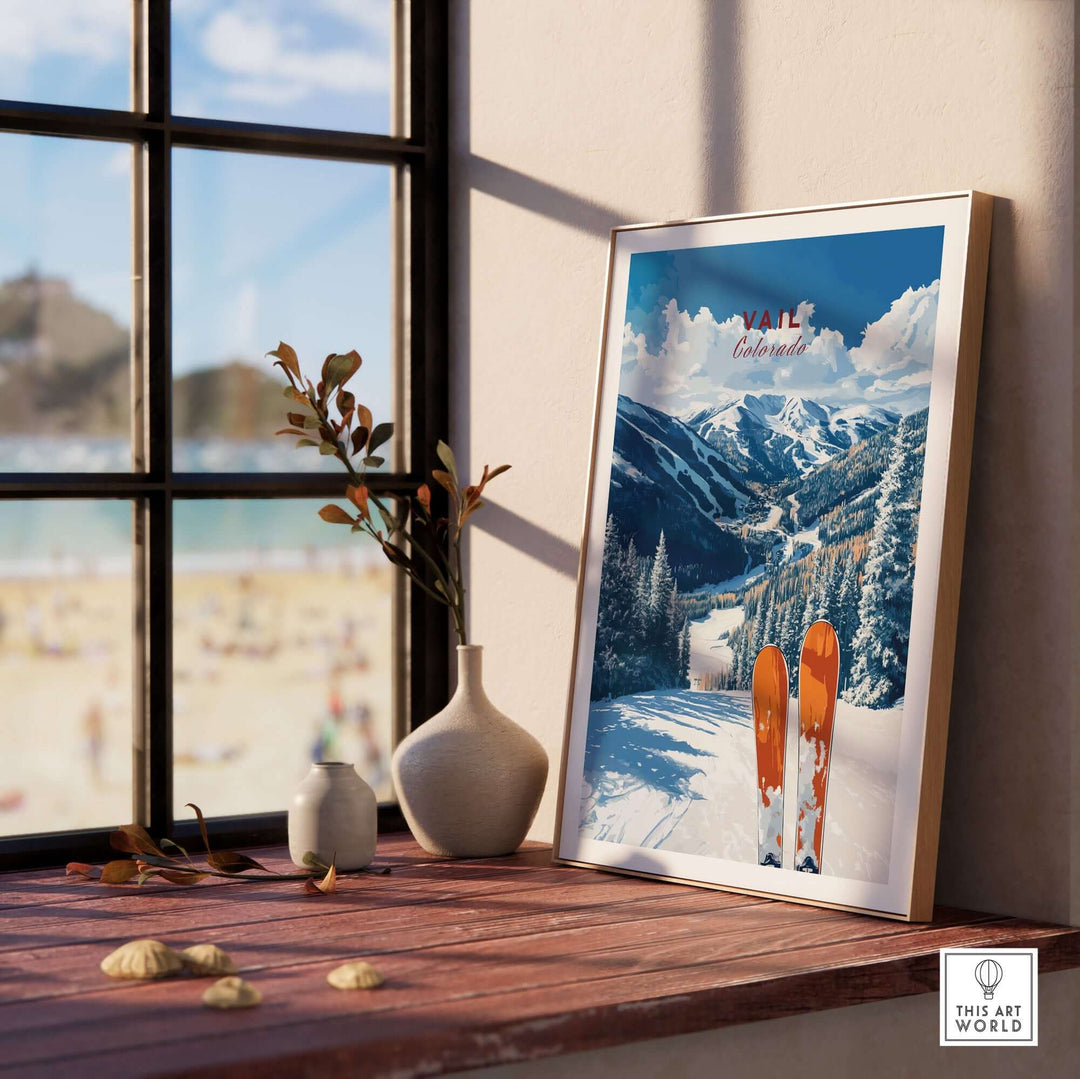 Vail travel poster featuring stunning Rockies views and ski equipment, displayed in a sunny room with a beach background.