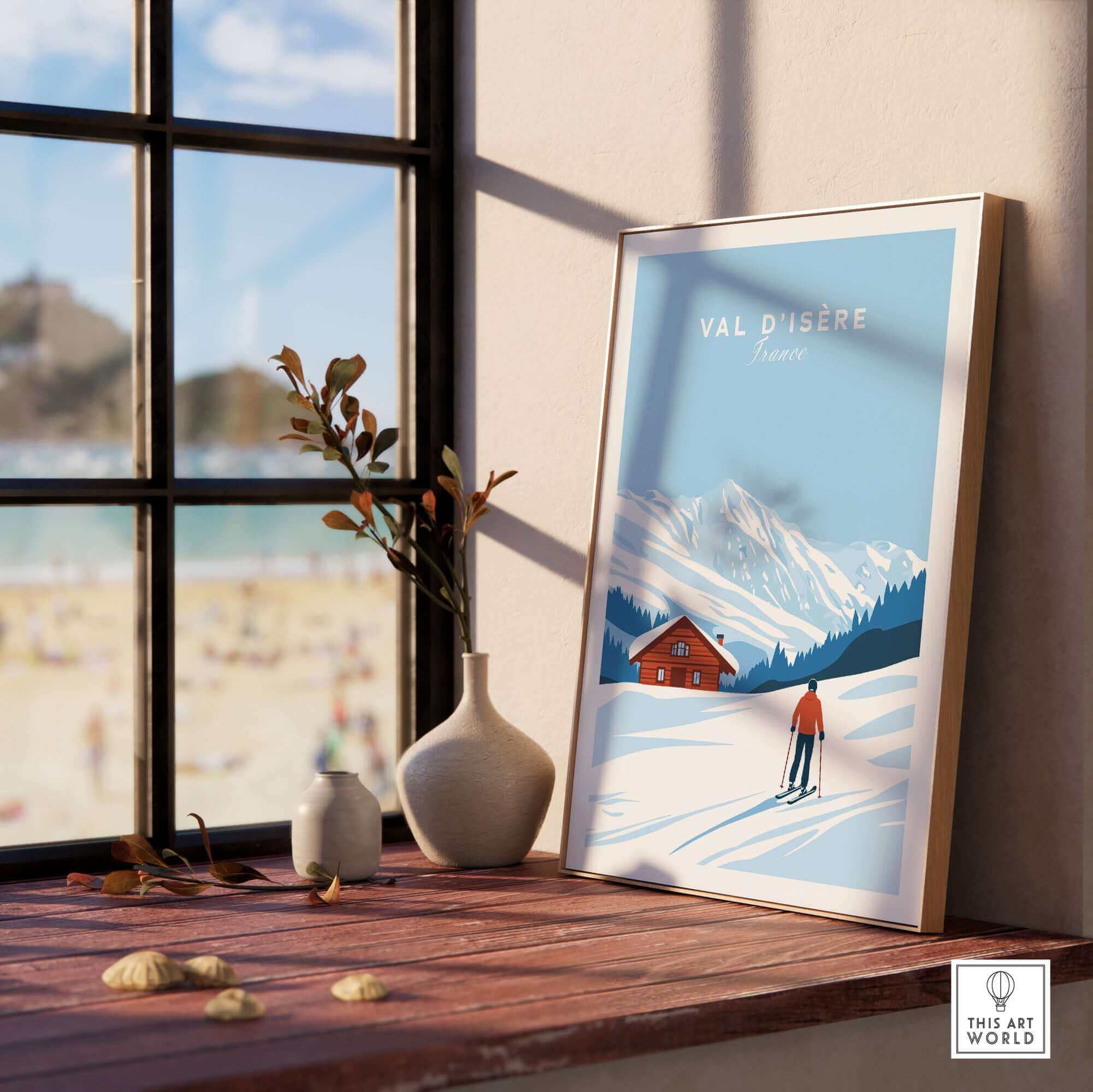 Val-d'Isère ski poster featuring a snowy mountain scene with chalet, displayed on a sunlit windowsill with vases, capturing French alpine charm.