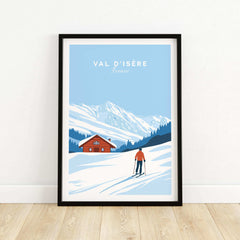 Val-d'Isère ski poster featuring a skier in front of a snowy mountain and chalet, capturing the charm of France's ski resorts.