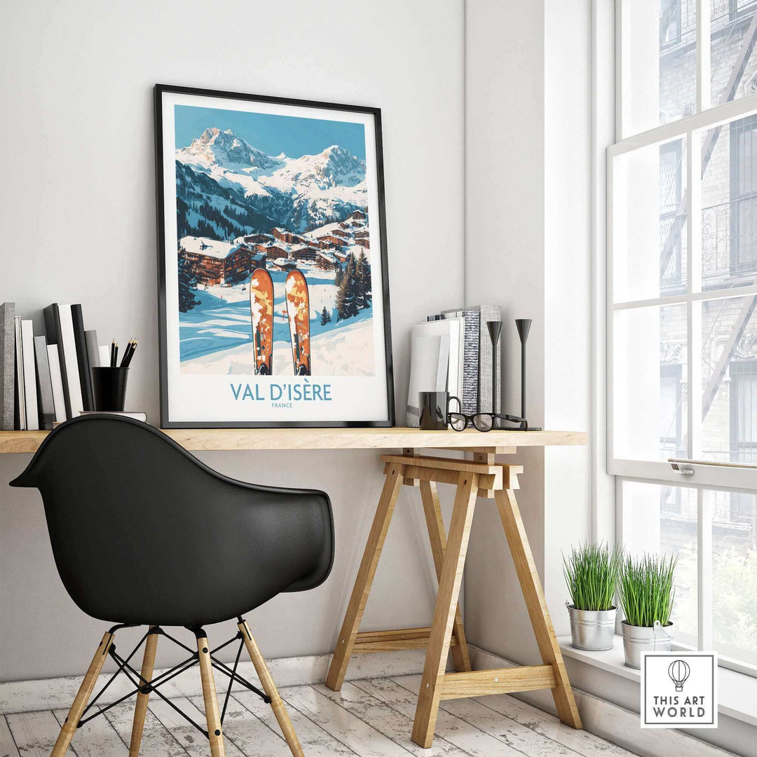 Val-d'Isère ski poster displayed on a modern desk in a stylish room, featuring scenic mountain views and ski equipment artwork.