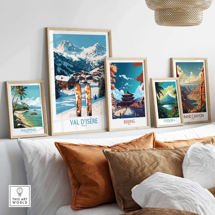 Art gallery wall featuring Val-d'Isère ski poster with scenic landscapes of Beijing, Costa Rica, the Philippines, and the Grand Canyon.