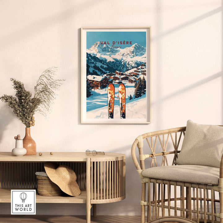 Vintage Val-d'Isère ski print in cozy interior with mountain landscape, displayed above rustic wicker chair and wooden console table.