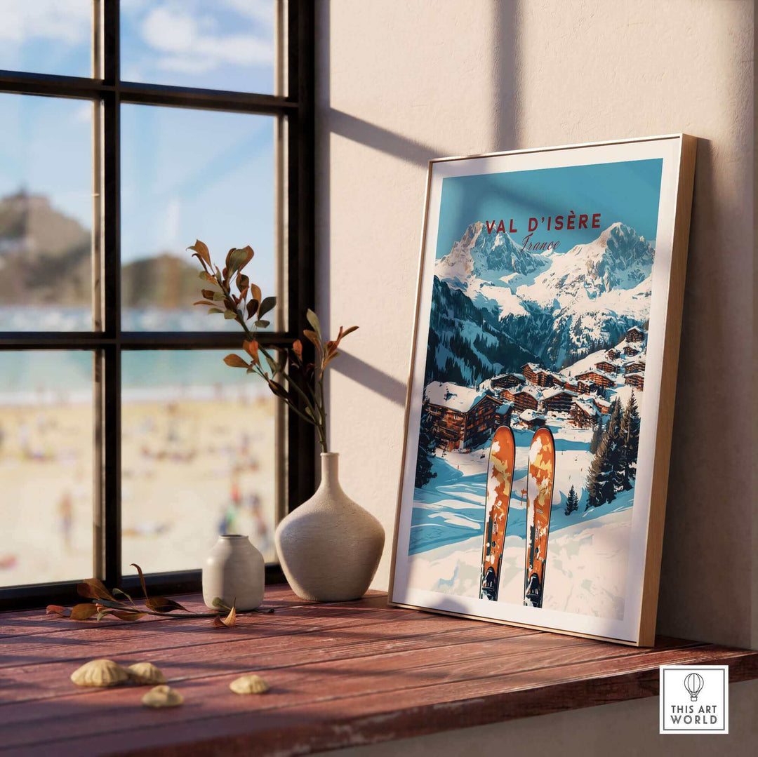 Val-d'Isère ski print on a windowsill with a snowy mountain scene and skis, enhancing chalet decor and alpine ambiance.